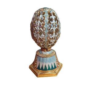 Vintage music box egg gold and blue couple inside